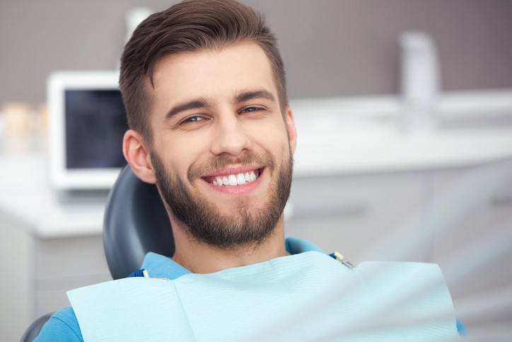 Man sitting in dentists chair
